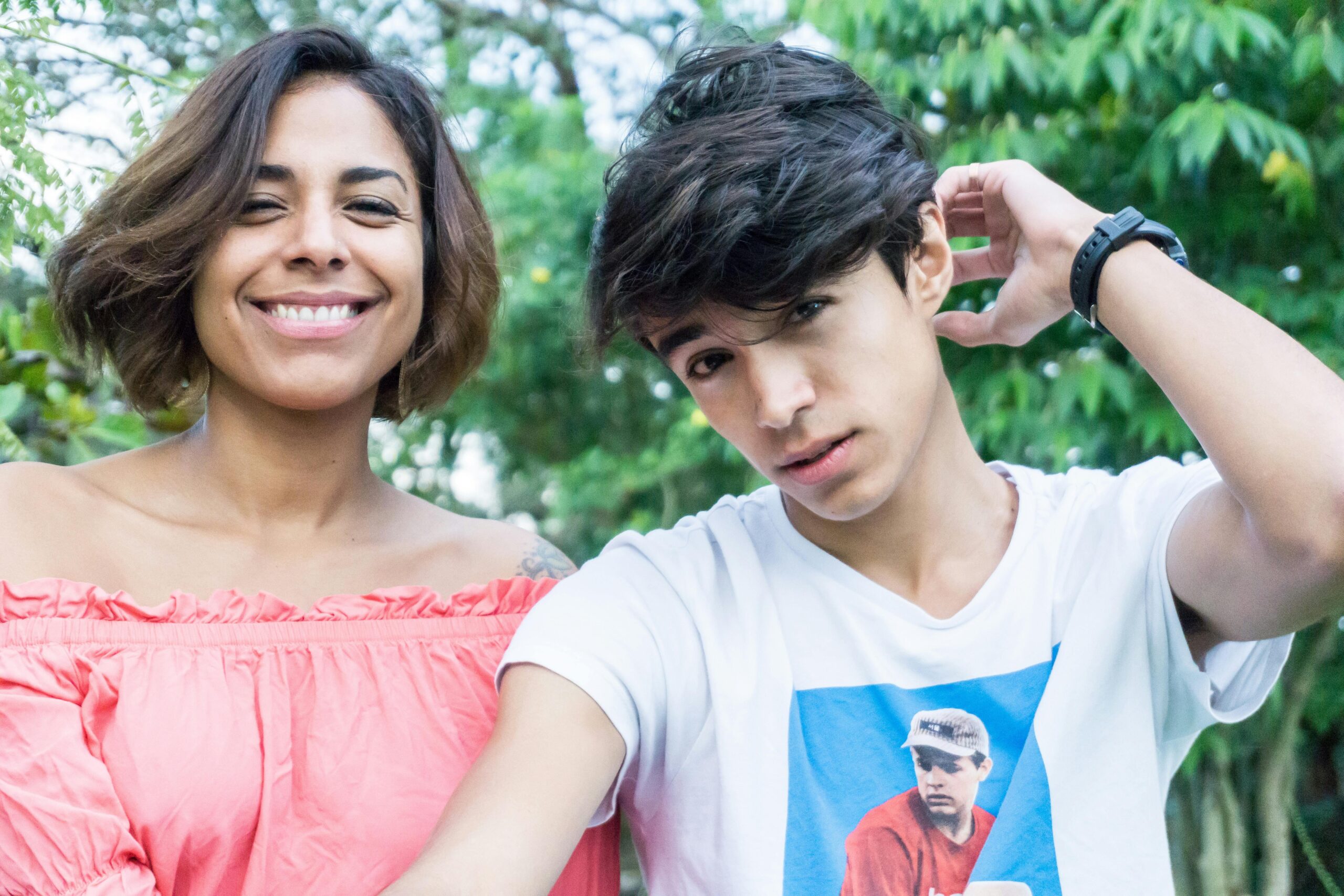 mum and teenage son smiling 